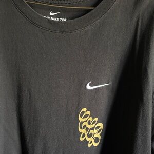 Nike Tee in Black with Gold and White Details